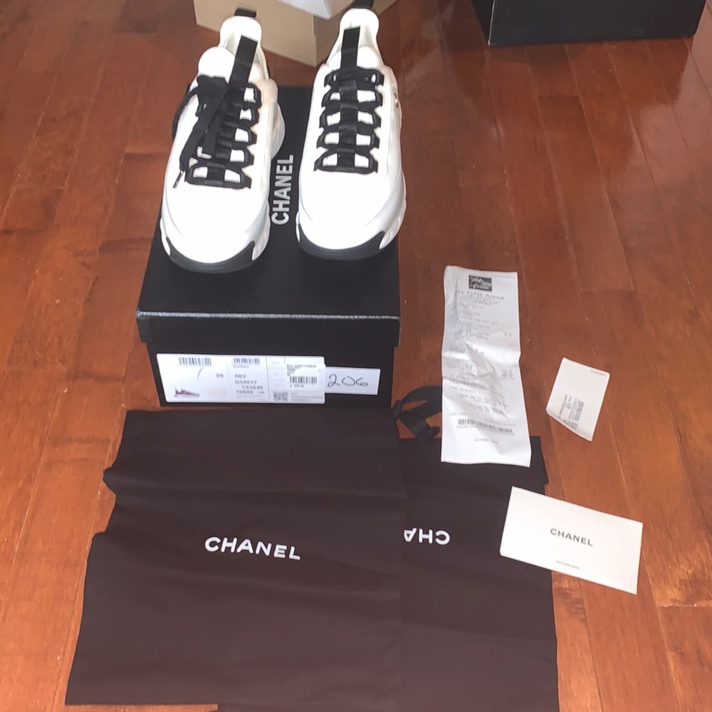Never worn white 100 percent authentic Chanel sneakers